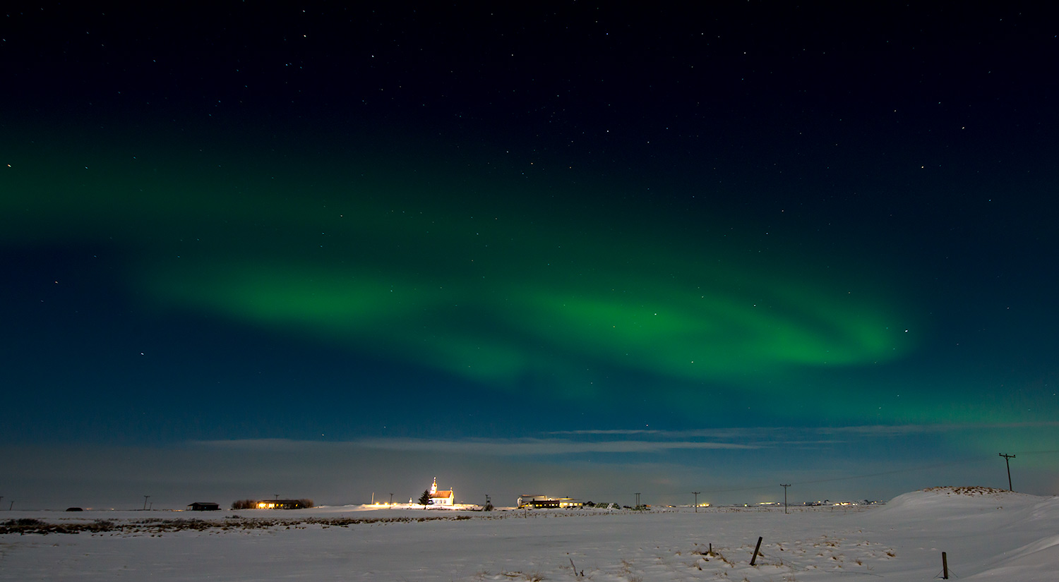 Aurora borealis over a church near Selfoss